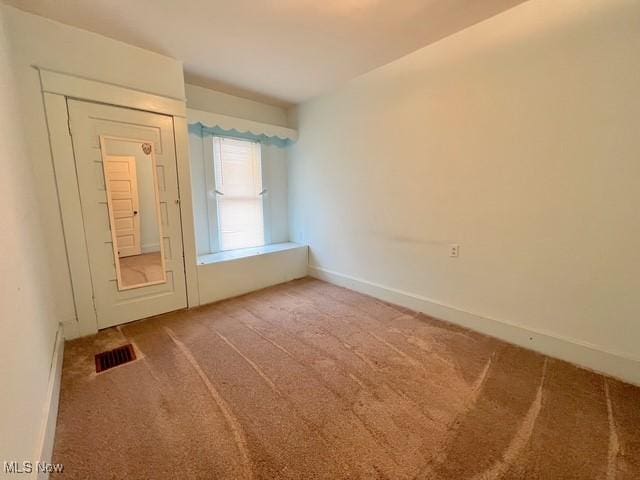 unfurnished room with carpet floors