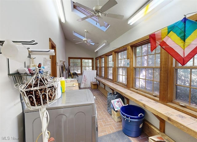 interior space featuring ceiling fan and independent washer and dryer