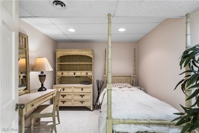 bedroom with a paneled ceiling