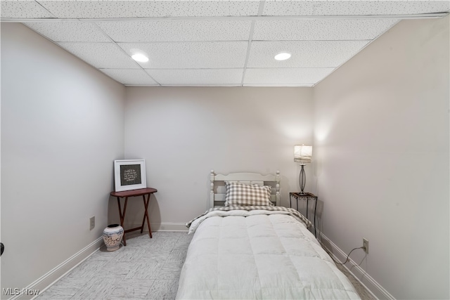 bedroom featuring a paneled ceiling