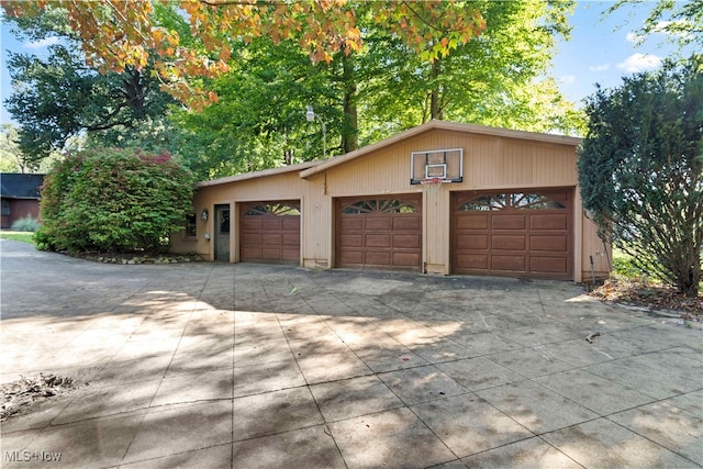 garage featuring wooden walls