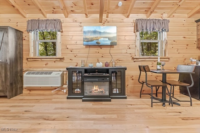 interior details featuring wood-type flooring, wooden walls, beam ceiling, and wooden ceiling