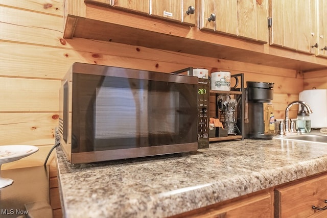 details with wooden walls and sink