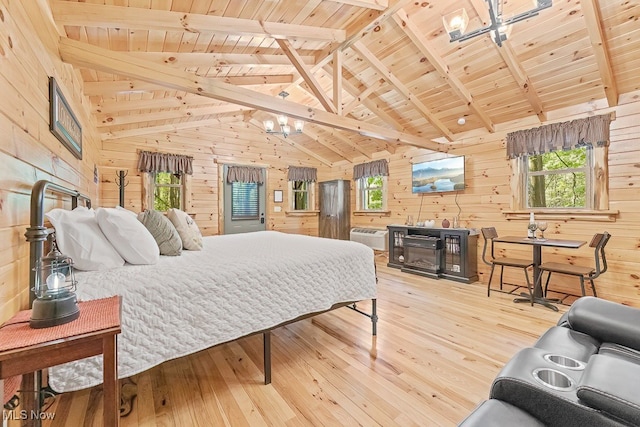 bedroom with an AC wall unit, beam ceiling, wood walls, hardwood / wood-style floors, and wooden ceiling