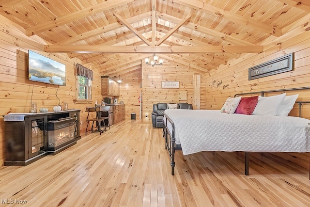 bedroom with wood ceiling, wood walls, lofted ceiling with beams, and light hardwood / wood-style flooring