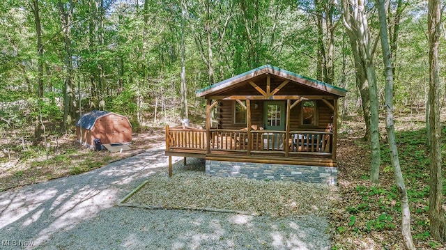 wooden terrace with a shed