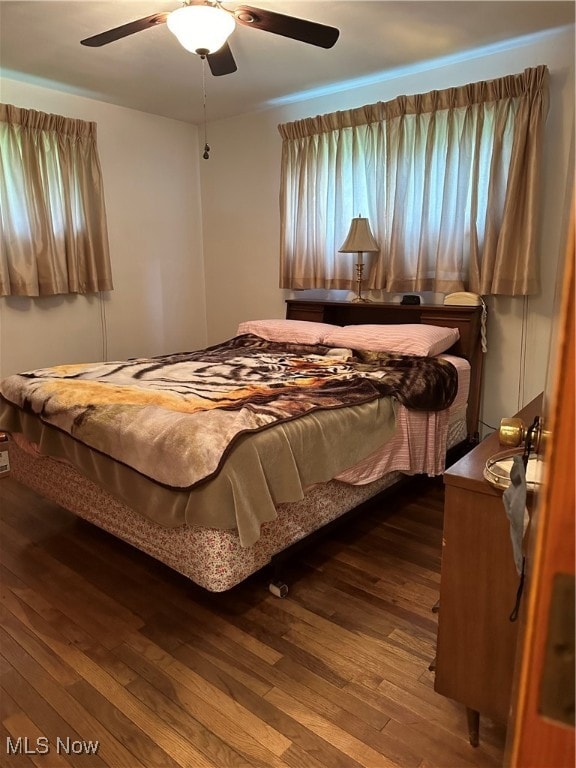 bedroom featuring hardwood / wood-style floors and ceiling fan