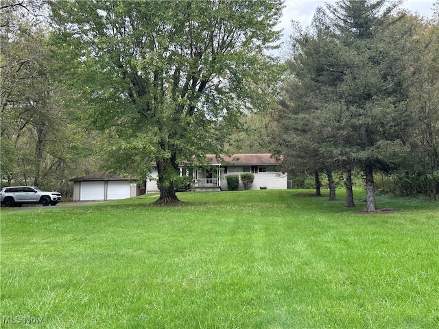 view of yard featuring a garage