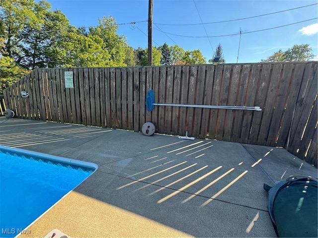 view of car parking featuring fence