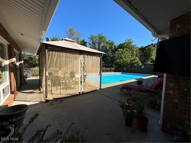 view of swimming pool with a patio area, a fenced backyard, and a fenced in pool