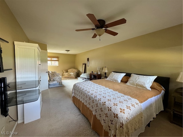 bedroom featuring a ceiling fan and light colored carpet