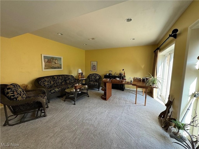 carpeted living area featuring lofted ceiling and recessed lighting