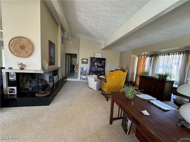 carpeted living area with visible vents, a tiled fireplace, a textured ceiling, high vaulted ceiling, and beam ceiling