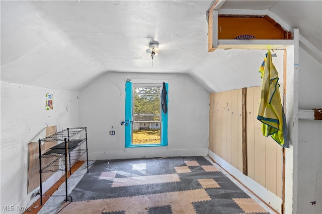 additional living space featuring vaulted ceiling