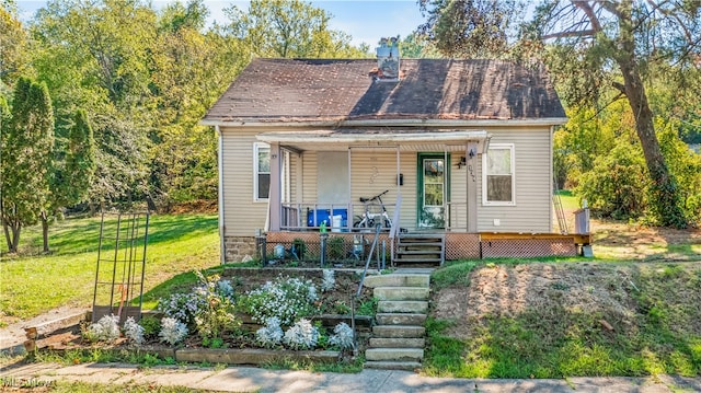 bungalow-style house with a front lawn and covered porch