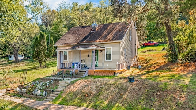 bungalow-style house with a front yard