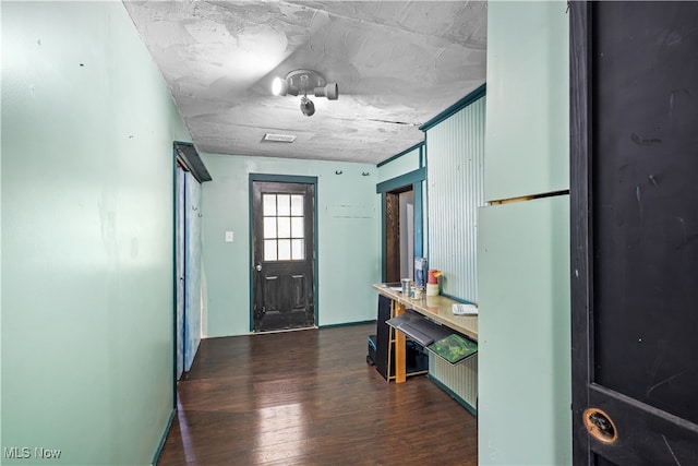 entrance foyer featuring dark wood-type flooring