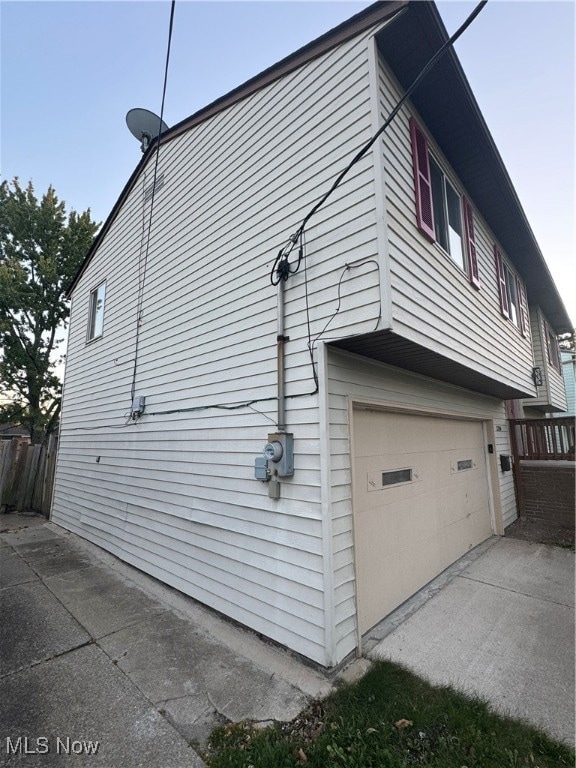 view of property exterior with a garage