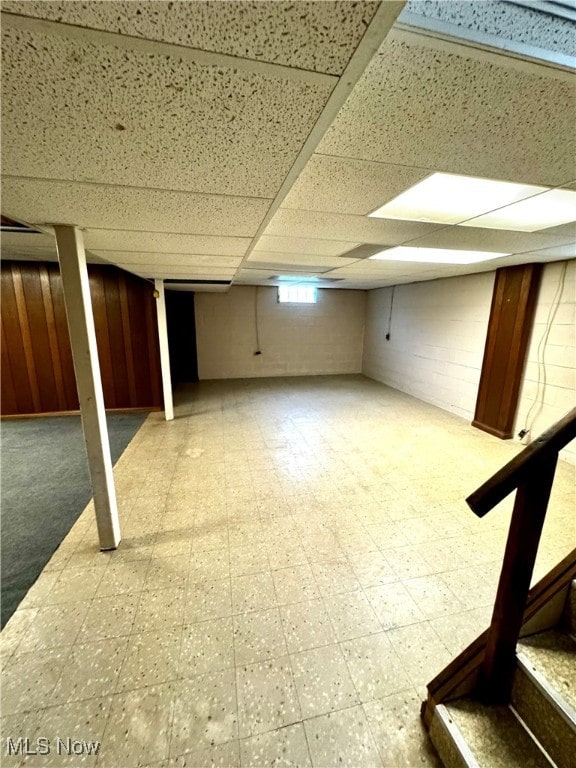 basement featuring a drop ceiling