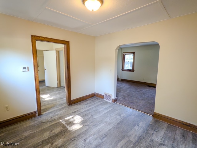 empty room with wood-type flooring