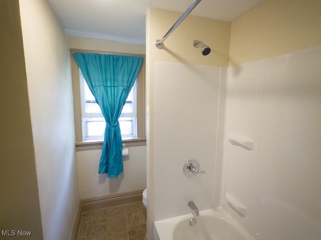 bathroom featuring toilet and shower / bathing tub combination