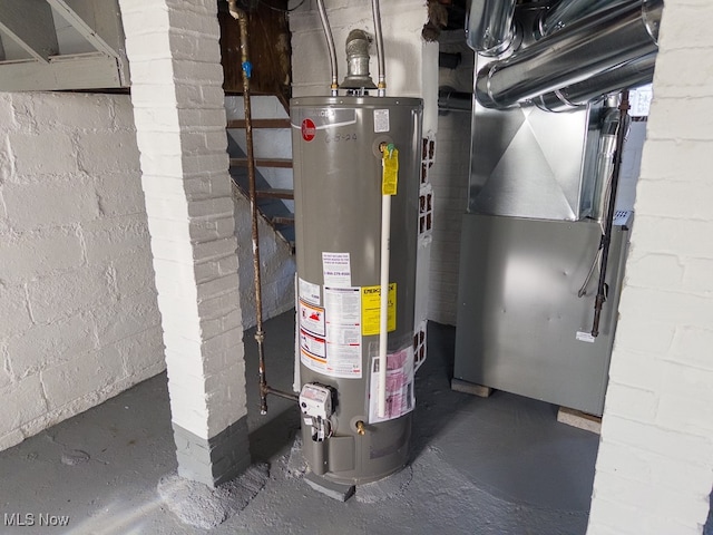 utility room featuring heating unit and water heater