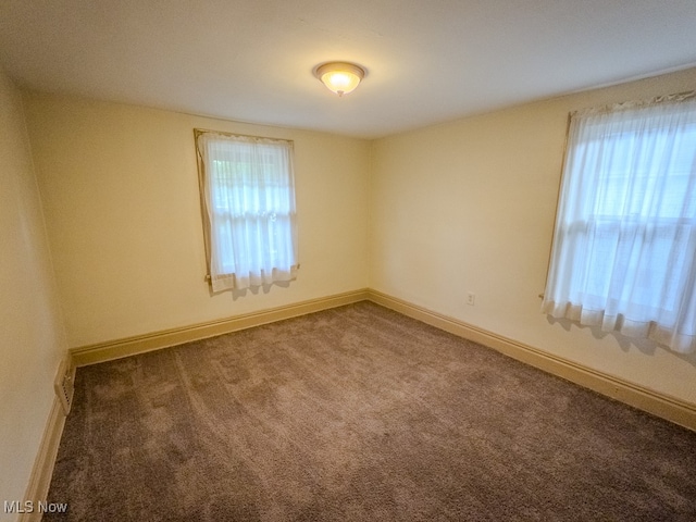 empty room featuring carpet floors