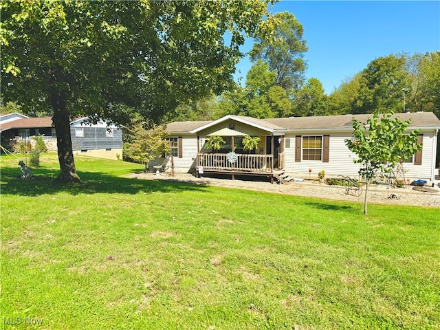 back of house with a lawn