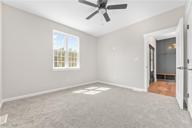 unfurnished room featuring carpet flooring and ceiling fan