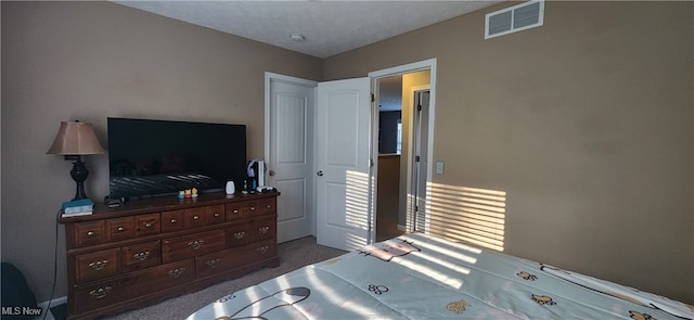 bedroom featuring dark carpet and a closet