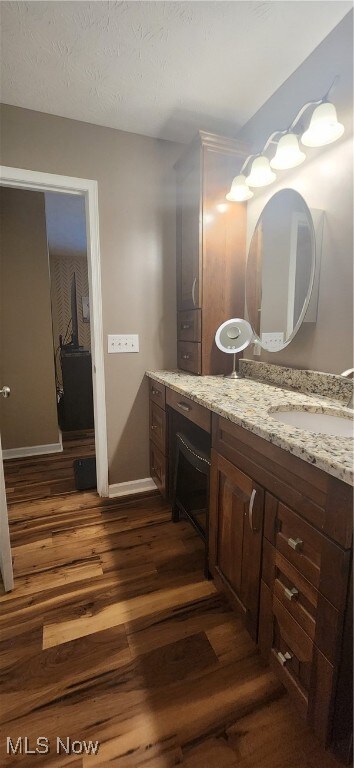 bathroom featuring hardwood / wood-style flooring and sink