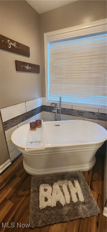 bathroom featuring a bathtub and hardwood / wood-style floors