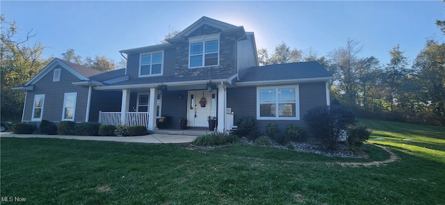 front of property featuring a front yard and covered porch