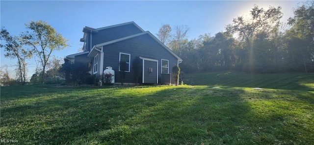 view of property exterior with a lawn