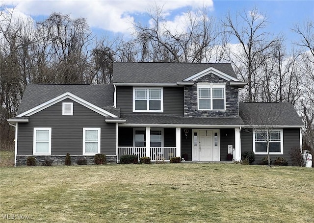 view of front of house featuring covered porch and a front lawn