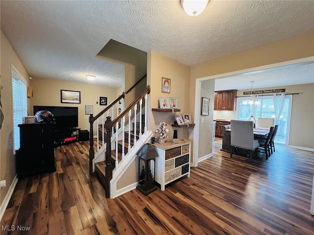 interior space with hardwood / wood-style flooring and a textured ceiling