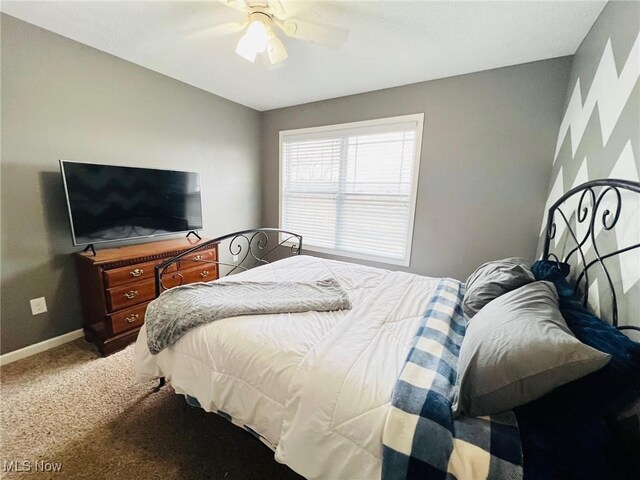 bedroom with ceiling fan and carpet floors