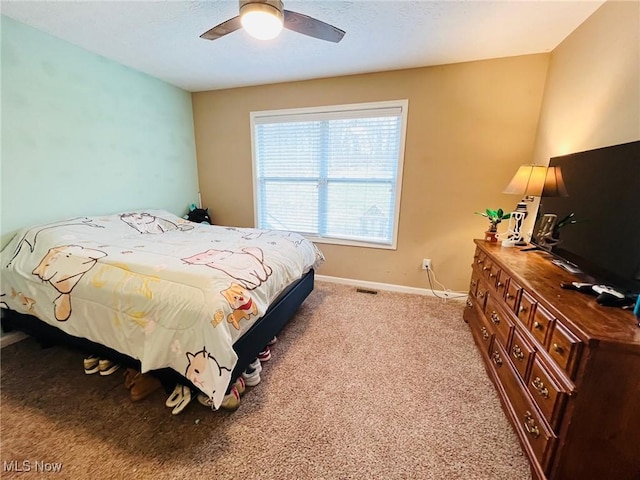 bedroom with light carpet and ceiling fan