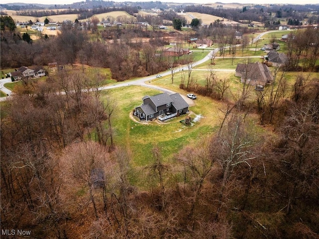 birds eye view of property with a rural view