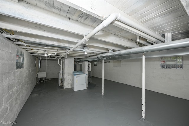 basement with washer / clothes dryer and sink