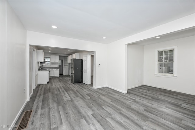 unfurnished living room featuring light hardwood / wood-style floors