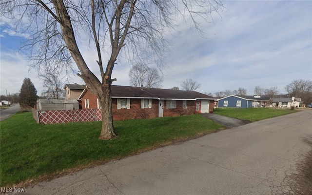 ranch-style house with a front yard