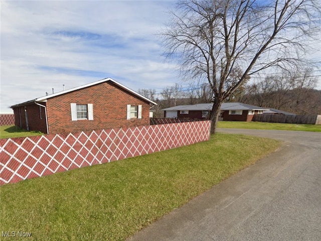 view of home's exterior featuring a lawn