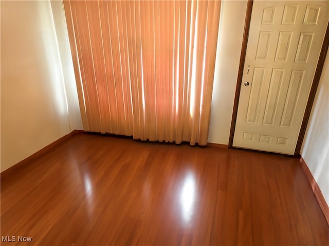 spare room featuring hardwood / wood-style floors