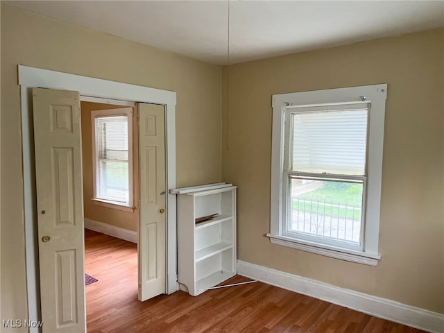 spare room featuring hardwood / wood-style floors