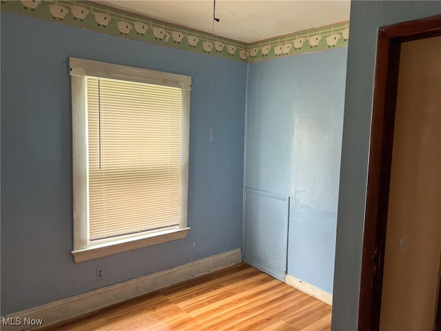 unfurnished room featuring hardwood / wood-style floors