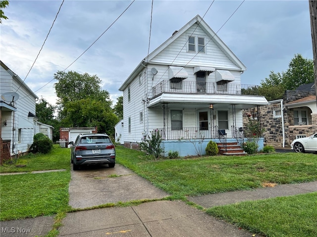 view of front of home with a porch and a front lawn