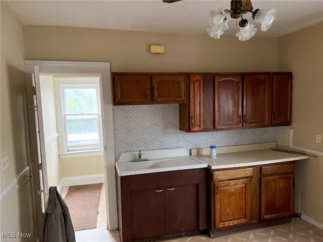 kitchen with tasteful backsplash and sink