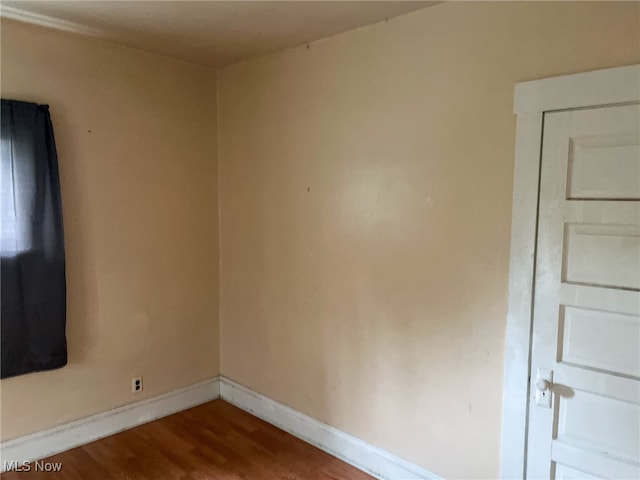 spare room with hardwood / wood-style floors