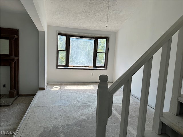 interior space with a textured ceiling